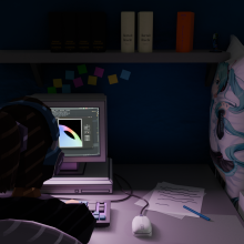 A backview of a person sitting in front of a PC