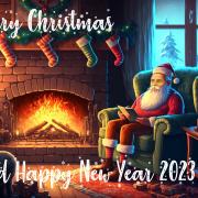 Christmas Card - showing Santa Claus (with Eduard Gröller's face) sitting on a comfortable chair close to a fireplace with a burning log fire. On top of the fireplace, there are four socks. To the right, you can see snowy trees through a window.